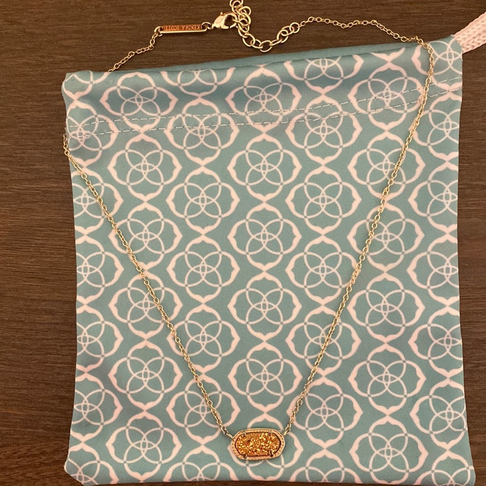 Kendra Scott gold necklace. Used but in good condition(comes with dust bag)